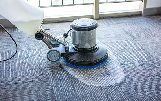 man cleaning carpet