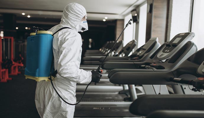 Professional disinfecting service on fitness center