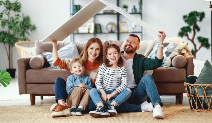 Happy family sitting on the floor indoor