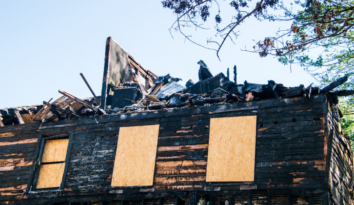 Boarded-up house after fire damage