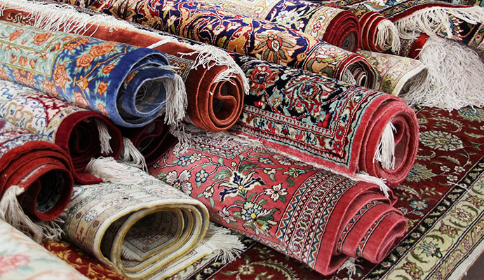 Different types of rug rolled together